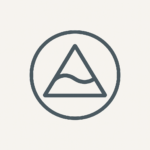 Icon of Circle with Triangle and a wave. Symbolically reflects the inner journey, the ripple effect of service, and emotional intelligence